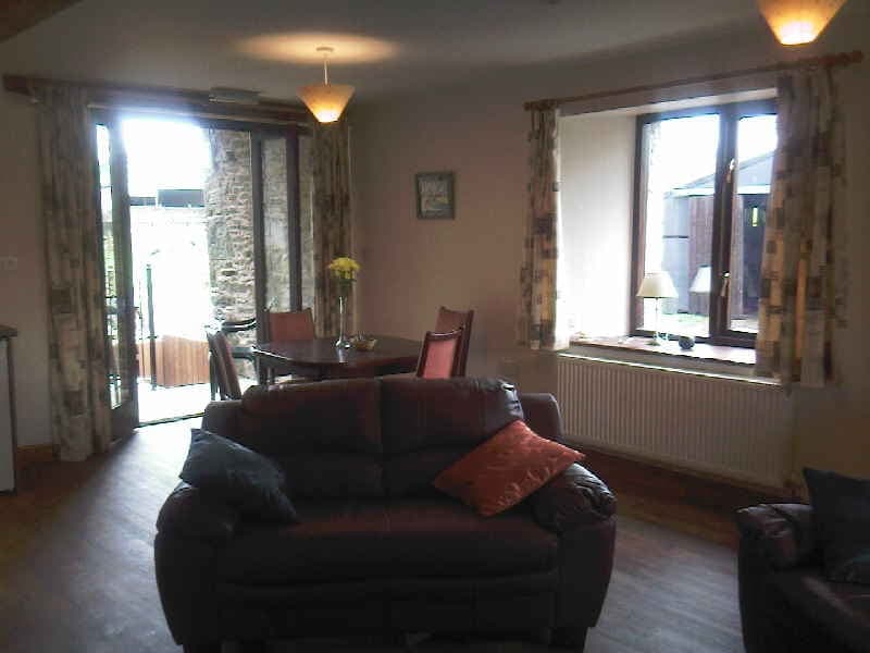 Lounge and dining area in Old Byre Cottage